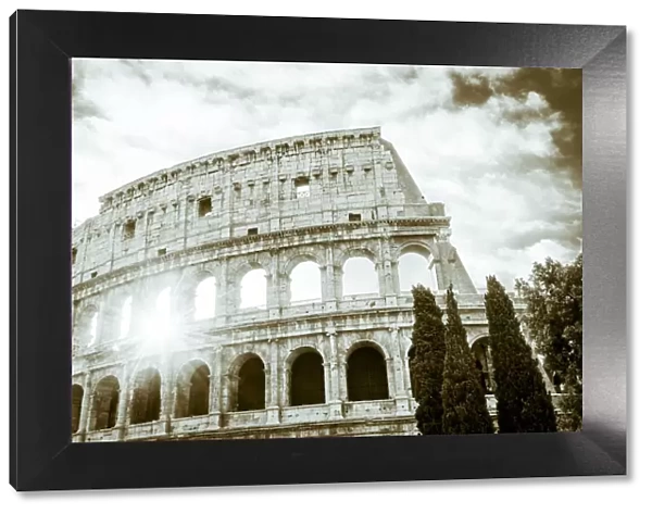 Europe, Italy, Rome. The Colosseum with morning sun, black and white