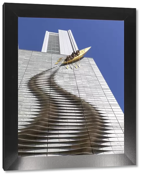 A sculpture of a canoe climbing a highrise building in Central Osaka, Osaka, Kansai