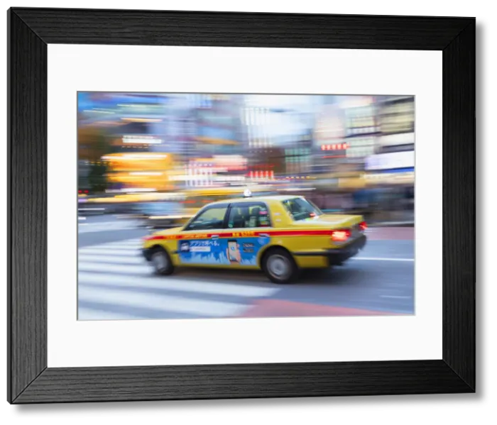 Framed Print : Taxi passing through Shibuya Crossing, Shibuya, Tokyo, Japan Framed Print : Taxi passing through Shibuya Crossing, Shibuya, Tokyo, Japan