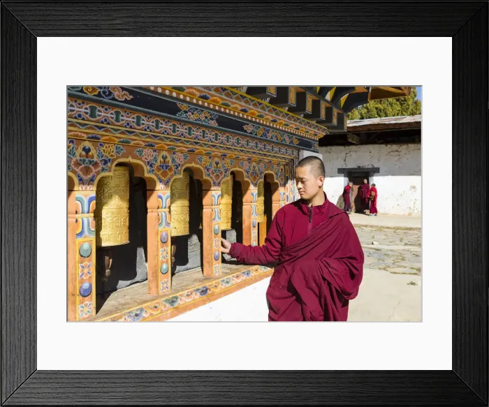 Framed Print : A monk spinning prayer wheels in Gangteng Monastery, Phobjikha Valley, Bhutan Framed Print : A monk spinning prayer wheels in Gangteng Monastery, Phobjikha Valley, Bhutan