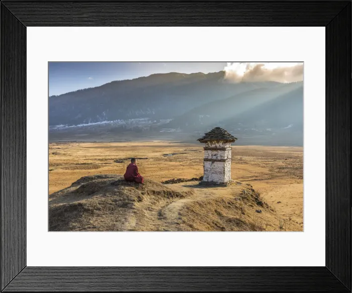 Framed Print : Novice Monk (Child Monk) praying in front of a stupa in Phobjikha Valley, Bhutan