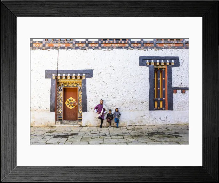 Framed Print : A man and kids standing in Trongsa Dzong, Trongsa District, Bhutan Framed Print : A man and kids standing in Trongsa Dzong, Trongsa District, Bhutan
