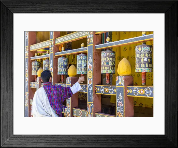 Framed Print : A man spinning prayer wheels in Trongsa Dzong, Trongsa District, Bhutan Framed Print : A man spinning prayer wheels in Trongsa Dzong, Trongsa District, Bhutan