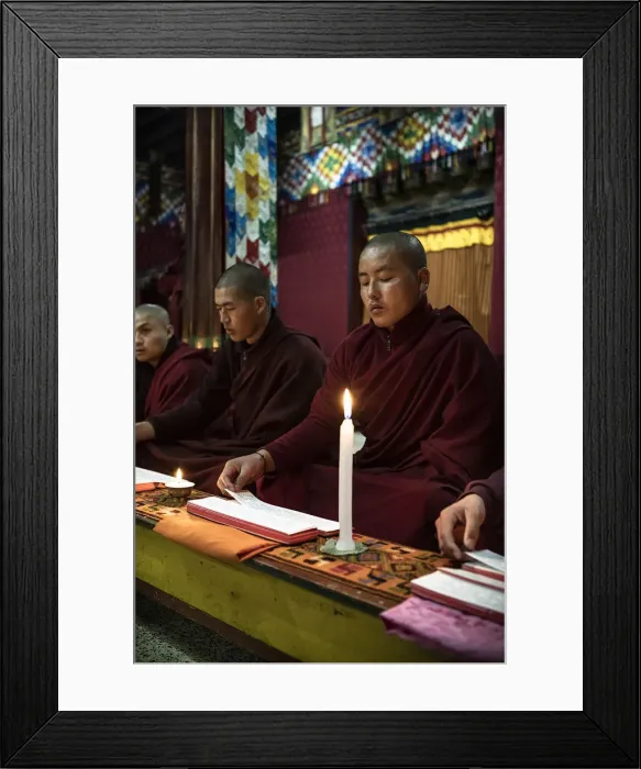 Framed Print : Monks during evening candle light prayer in Lhodrak Kharchu monastery, Jakar