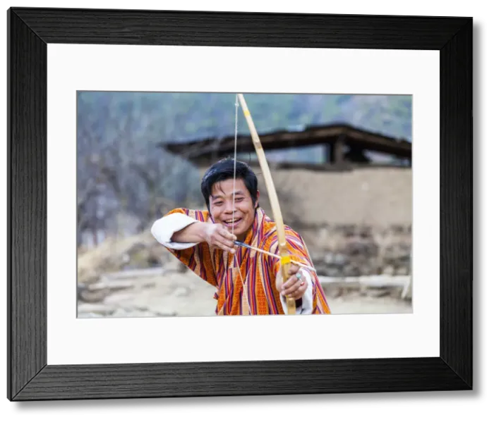 Framed Print : A man doing archery in Paro District, Bhutan Framed Print : A man doing archery in Paro District, Bhutan