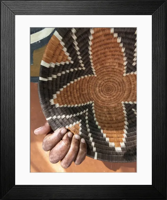 Framed Print : A traditional basket weaver with basket in Maun, Botswana Framed Print : A traditional basket weaver with basket in Maun, Botswana