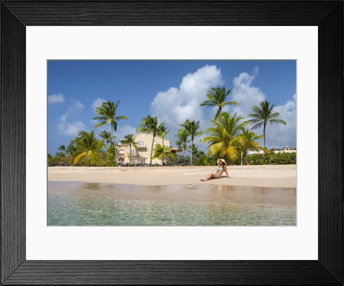 Framed Print : Girl sunbathes on the beach facing the turquoise water of the Caribbean sea Framed Print : Girl sunbathes on the beach facing the turquoise water of the Caribbean sea