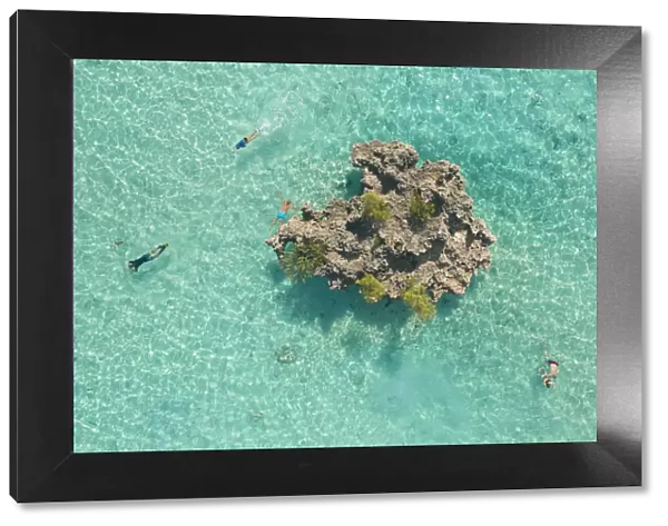 a drone shot to capture some people snorkeling around Crystal Rock, Le Morne Brabant