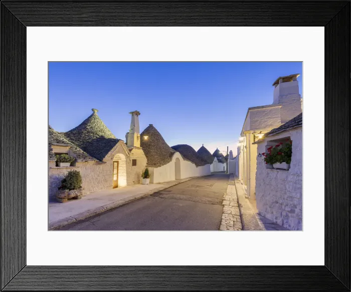Framed Print : Alley between white trulli houses at dusk. Unesco World Heritage Site, Alberobello Framed Print : Alley between white trulli houses at dusk. Unesco World Heritage Site, Alberobello