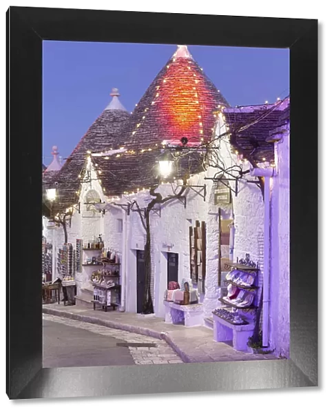 Traditional trullo house illuminated by christmas lights