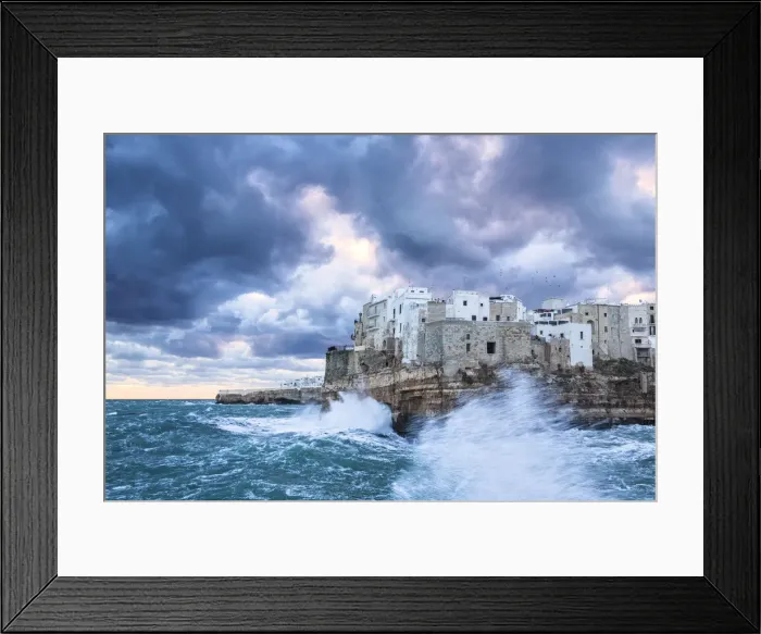 Framed Print : Waves crash on the cliff during a winter storm. Polignano a Mare, Apulia, Italy Framed Print : Waves crash on the cliff during a winter storm. Polignano a Mare, Apulia, Italy