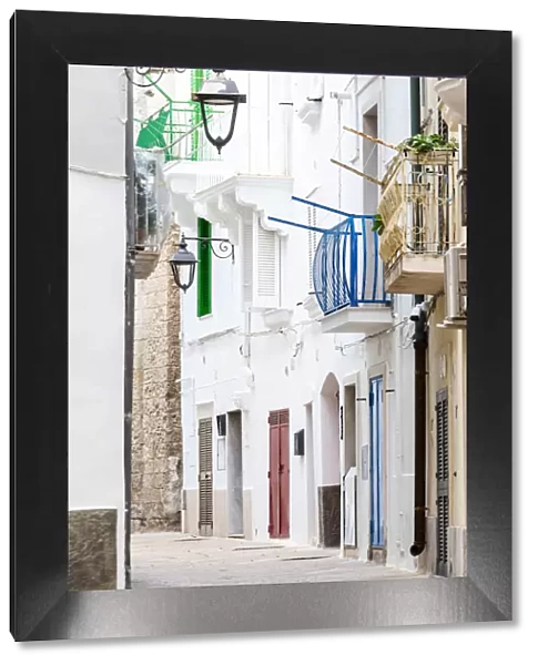 Narrow white street in the historic centre of Monopoli, Apulia, Italy