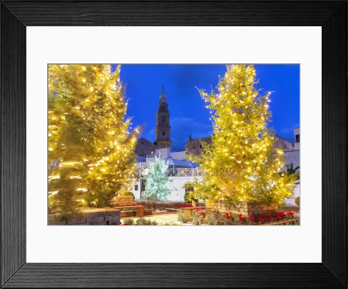 Framed Print : Christmas trees in the old town of Monopoli with view on the tower bell of the cathedral Framed Print : Christmas trees in the old town of Monopoli with view on the tower bell of the cathedral