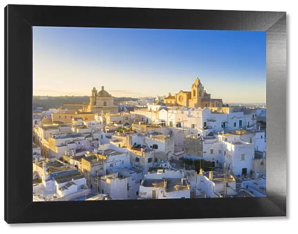 Aerial view of the old town of Ostuni at sunset, Apulia, Italy
