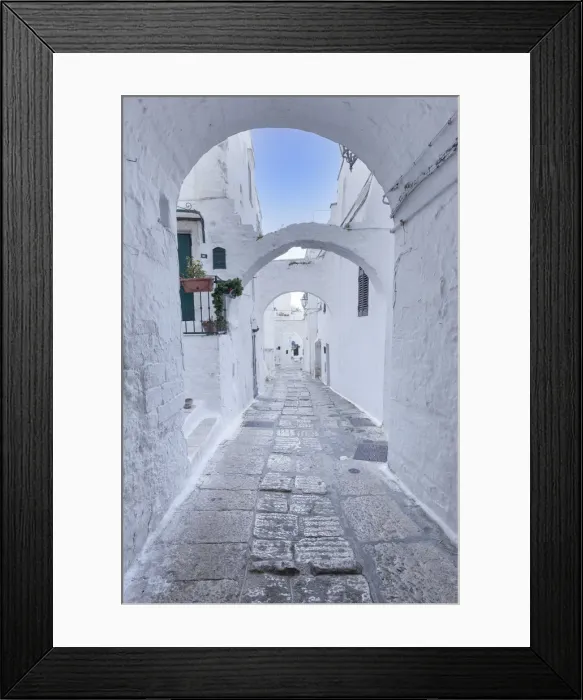 Framed Print : White narrow street of Polignano a Mare, Apulia, Italy Framed Print : White narrow street of Polignano a Mare, Apulia, Italy
