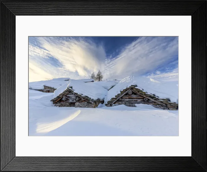 Framed Print : Stunning clouds at sunrise above traditional old huts in winter Framed Print : Stunning clouds at sunrise above traditional old huts in winter