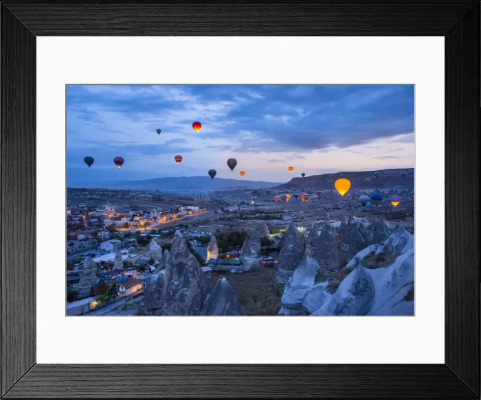 Framed Print : Hot air balloons flying in the blue sky of Goreme at dusk Framed Print : Hot air balloons flying in the blue sky of Goreme at dusk