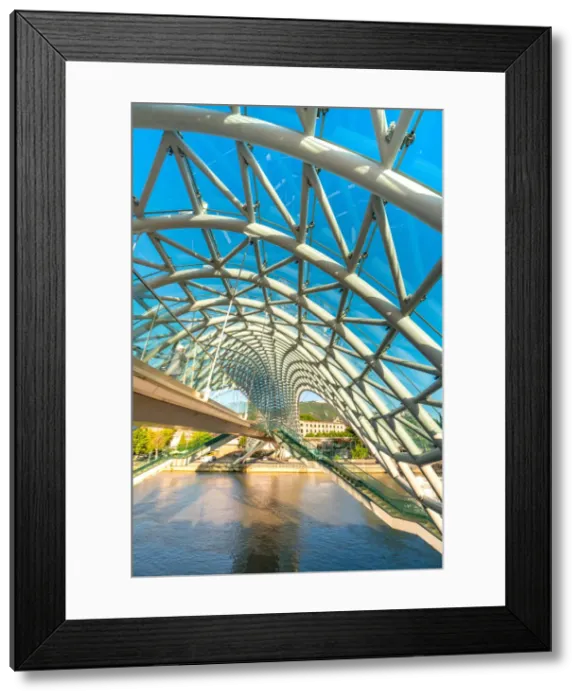 Framed Print : The modern architecture of Pace bridge over Kura river. Tbilisi, Georgia Framed Print : The modern architecture of Pace bridge over Kura river. Tbilisi, Georgia