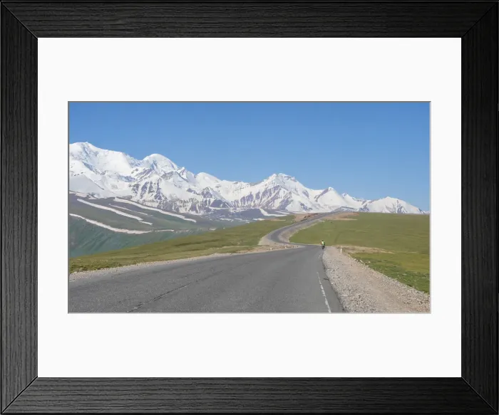 Framed Print : Cyclist along Irkestam pass road with Pamir peaks in the background Framed Print : Cyclist along Irkestam pass road with Pamir peaks in the background