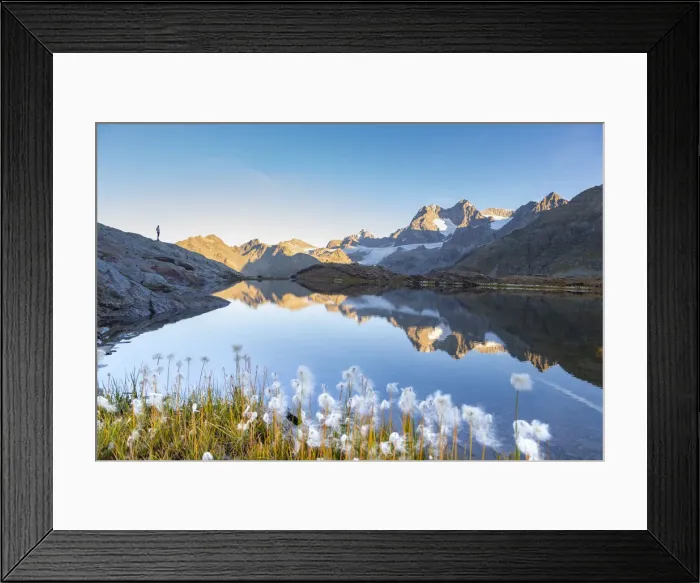 Framed Print : Hiker silhouette along an alpine lake during summer in italian Alps mountains