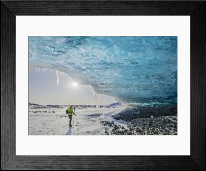 Framed Print : Man photographs an ice cave of Breidamerkurjokull, Austurland, Iceland