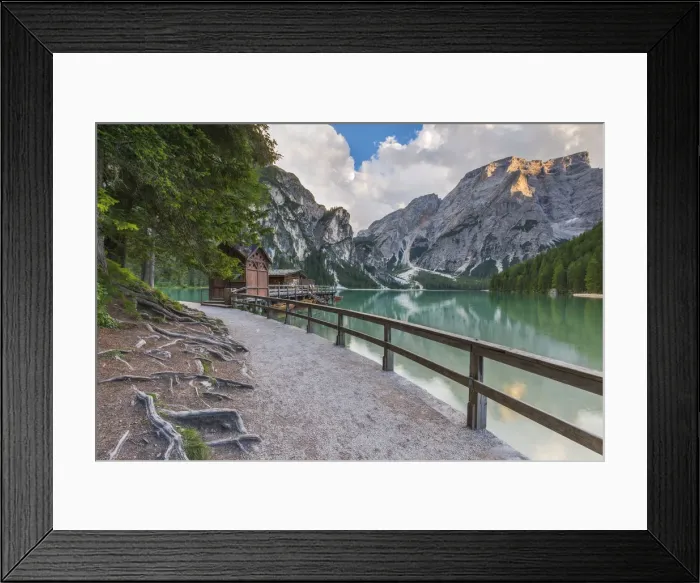 Framed Print : A view of Croda del Becco and footpath and house of boats from Braies lake at sunset Framed Print : A view of Croda del Becco and footpath and house of boats from Braies lake at sunset