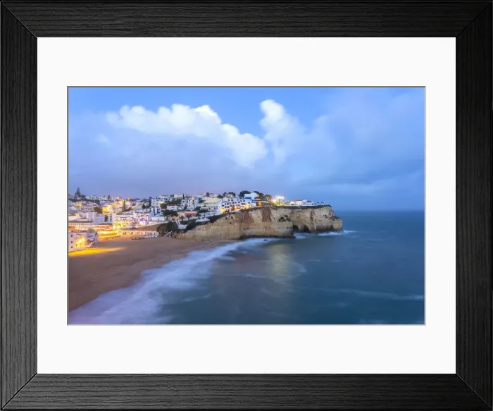Framed Print : View of the lights of the village of Carvoeiro and its beach at blue hour Framed Print : View of the lights of the village of Carvoeiro and its beach at blue hour