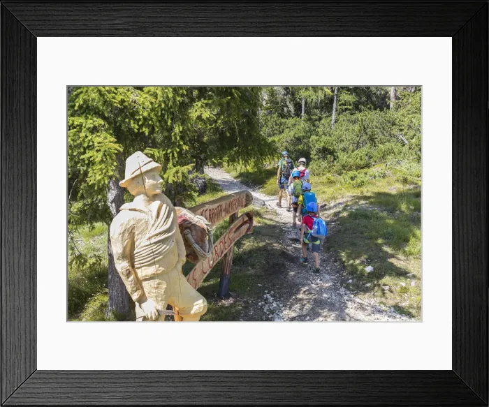 Framed Print : a group of hikers are going to climb the via ferrata (iron path