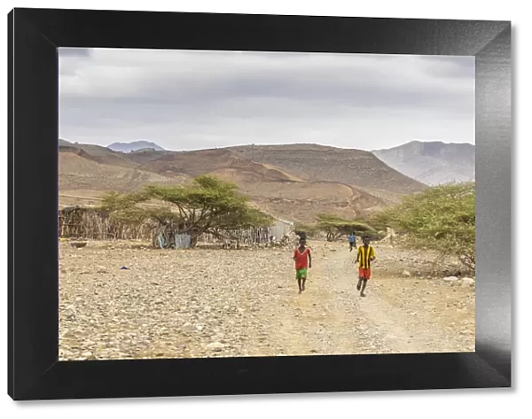 Children running in Melabday ethiopian village, Asso Bhole, Dallol, Danakil Depression