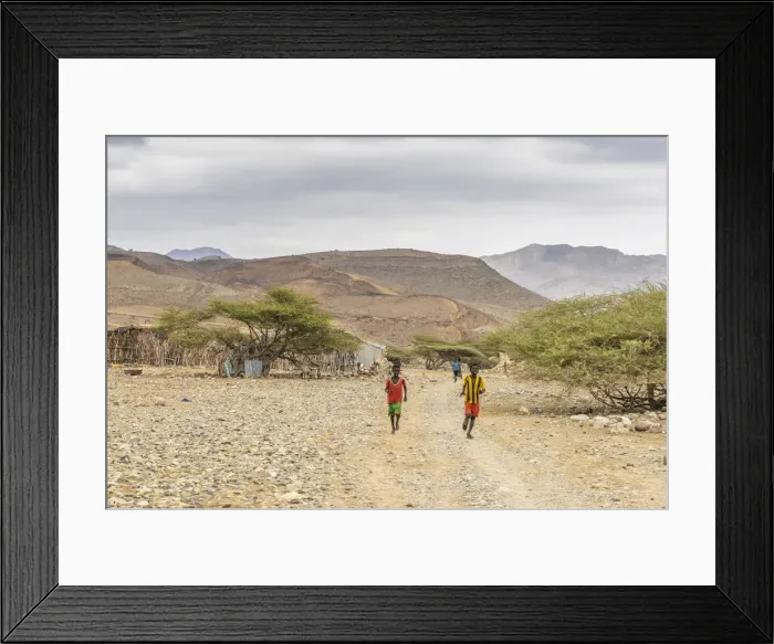 Framed Print : Children running in Melabday ethiopian village, Asso Bhole, Dallol, Danakil Depression