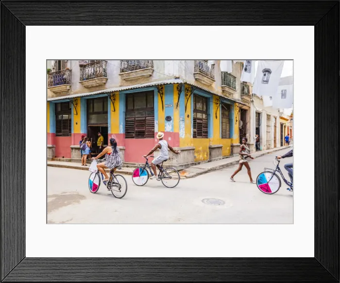 Framed Print : People cycling in a street in La Habana Vieja (Old Town), Havana, Cuba