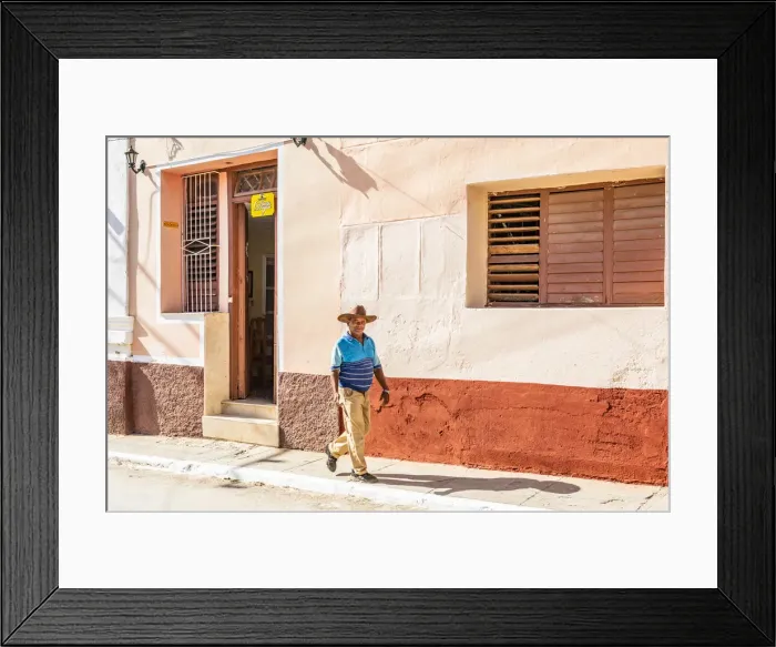 Framed Print : A man walking in a street in Trinidad, Sancti Spiritus, Cuba Framed Print : A man walking in a street in Trinidad, Sancti Spiritus, Cuba