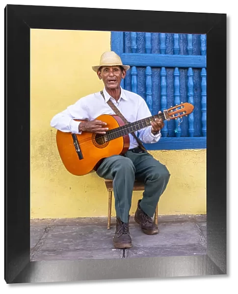 A musician playing the guitar in Plaza Mayor in Trinidad, Sancti Spiritus, Cuba