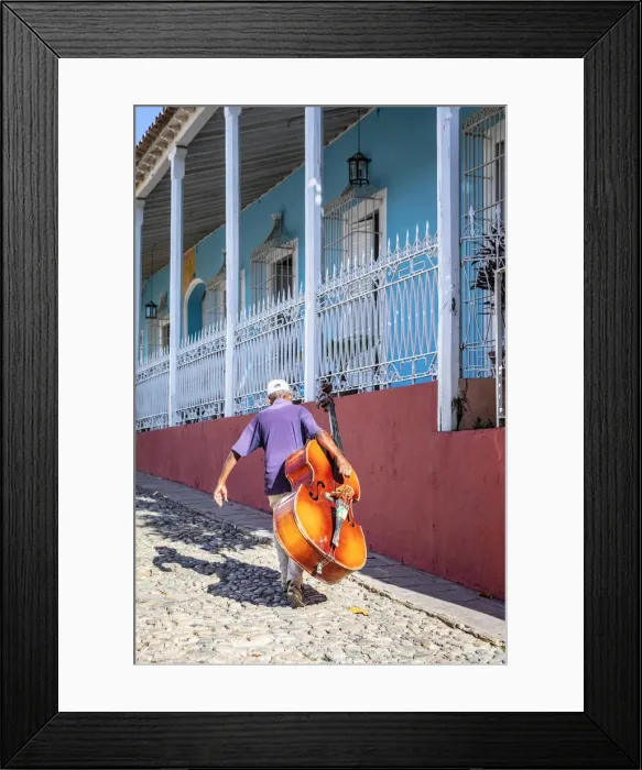 Framed Print : A man carrying a cello in Plaza Mayor in Trinidad, Sancti Spiritus, Cuba Framed Print : A man carrying a cello in Plaza Mayor in Trinidad, Sancti Spiritus, Cuba