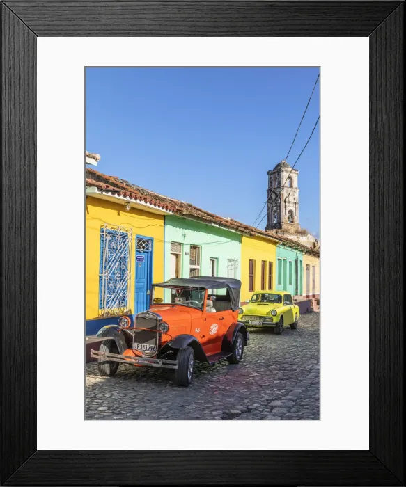 Framed Print : A classic car driving in a street in Trinidad, Sancti Spiritus, Cuba