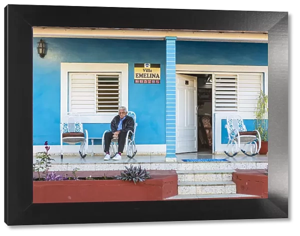 A man sitting outside his casa in Vinales, Pinar del Rio Province, Cuba