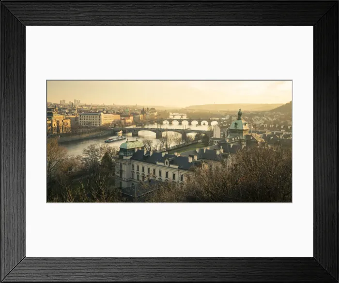 Framed Print : Bridges over Vltava river and Straka Academy against sky seen from Letna park at sunset Framed Print : Bridges over Vltava river and Straka Academy against sky seen from Letna park at sunset