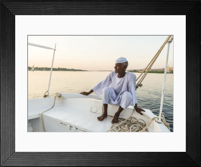 Framed Print : Nubian sailor on his felucca boat on the Nile River, Aswan, Upper Egypt, Egypt, Africa Framed Print : Nubian sailor on his felucca boat on the Nile River, Aswan, Upper Egypt, Egypt, Africa