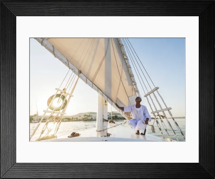 Framed Print : Nubian sailor on his felucca boat on the Nile River, Aswan, Upper Egypt, Egypt, Africa Framed Print : Nubian sailor on his felucca boat on the Nile River, Aswan, Upper Egypt, Egypt, Africa