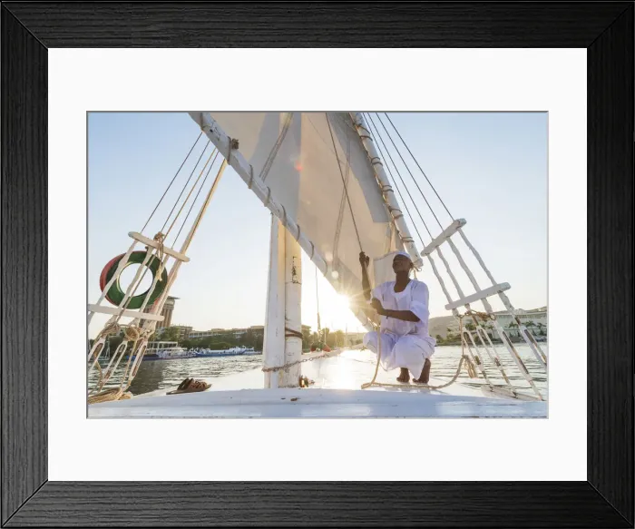 Framed Print : Nubian sailor on his felucca boat on the Nile River, Aswan, Upper Egypt, Egypt, Africa Framed Print : Nubian sailor on his felucca boat on the Nile River, Aswan, Upper Egypt, Egypt, Africa