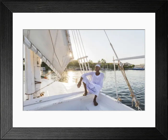 Framed Print : Nubian sailor on his felucca boat on the Nile River, Aswan, Upper Egypt, Egypt, Africa Framed Print : Nubian sailor on his felucca boat on the Nile River, Aswan, Upper Egypt, Egypt, Africa