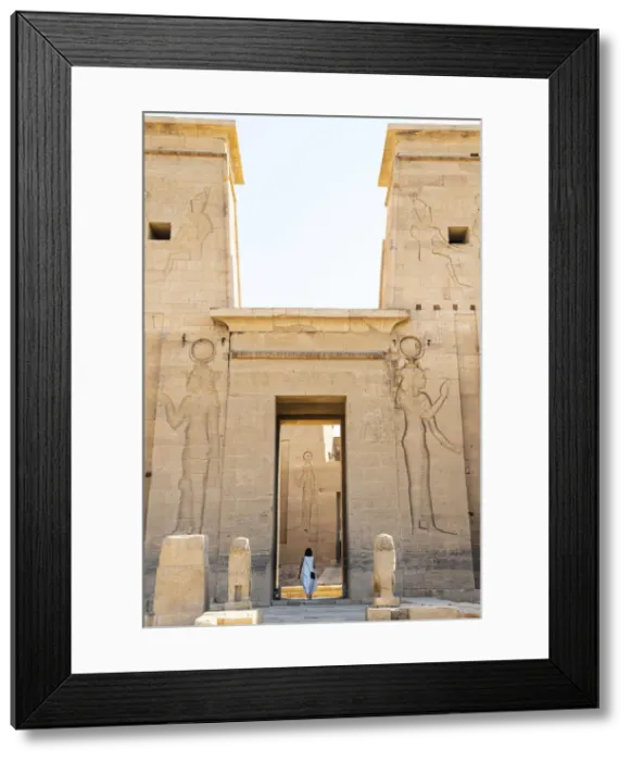 Framed Print : Tourist walking throuhg the Temple of Philae on an island in Lake Nasser, Nile River Framed Print : Tourist walking throuhg the Temple of Philae on an island in Lake Nasser, Nile River