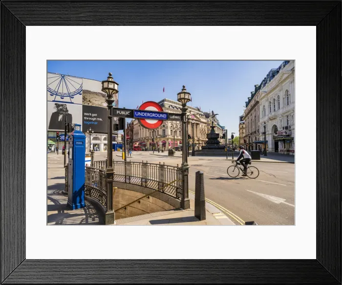 Framed Print : Cyclist going through Piccadilly Circus, London, England, UK Framed Print : Cyclist going through Piccadilly Circus, London, England, UK