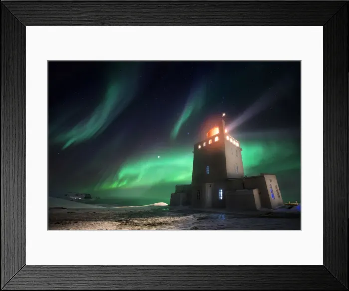 Framed Print : Dyrholaey lighthouse in winter with aurora borealis dancing above it, Sudurland, Iceland Framed Print : Dyrholaey lighthouse in winter with aurora borealis dancing above it, Sudurland, Iceland