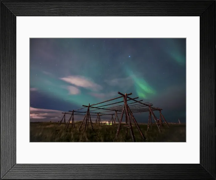 Framed Print : Low angle view Aurora borealis over wooden stands for fish drying at night, Reykjavik Framed Print : Low angle view Aurora borealis over wooden stands for fish drying at night, Reykjavik