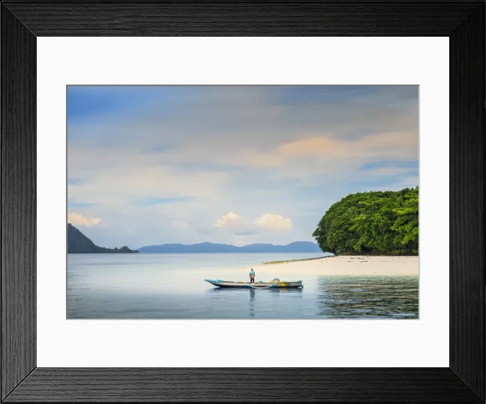 Framed Print : Asia, Indonesia, Spice Islands, Ambon, Malona Island, a local fisherman in front of a Framed Print : Asia, Indonesia, Spice Islands, Ambon, Malona Island, a local fisherman in front of a