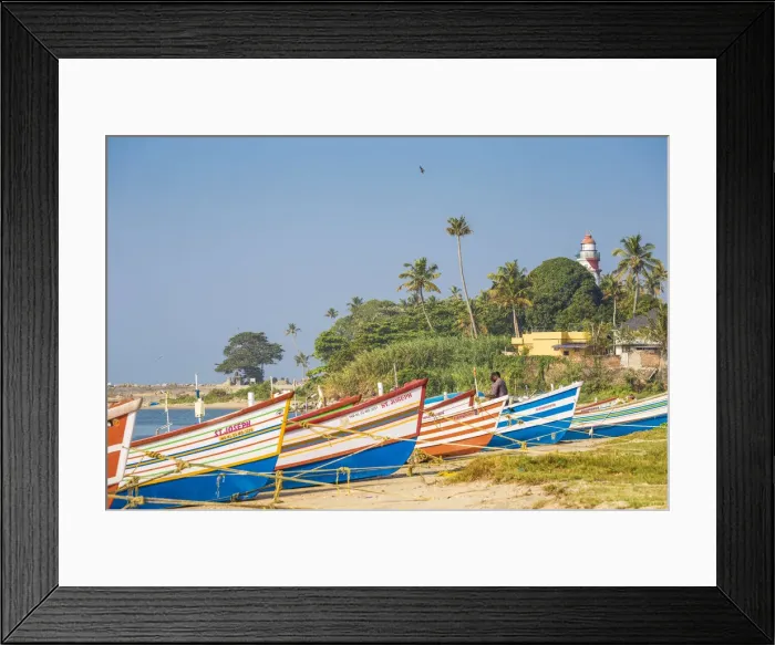Framed Print : India, Kerala, Kollam, Fishing boats on beach with Tangasseri Lighthouse in background Framed Print : India, Kerala, Kollam, Fishing boats on beach with Tangasseri Lighthouse in background
