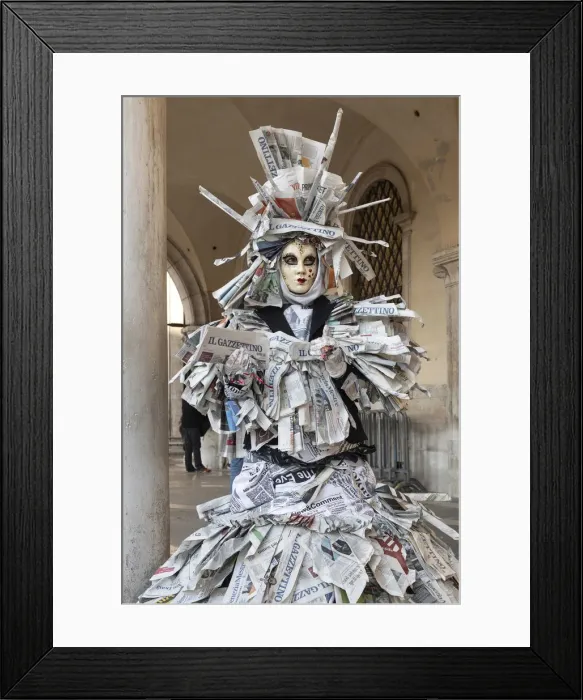 Framed Print : A woman covered in newspaper walks through St. Mark Framed Print : A woman covered in newspaper walks through St. Mark