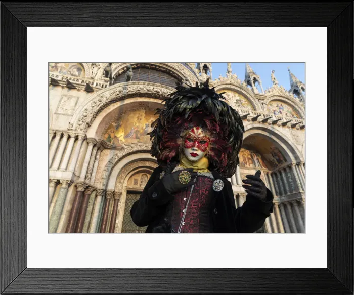 Framed Print : A woman in costume stands in front of the Basilica San Marco in St Framed Print : A woman in costume stands in front of the Basilica San Marco in St