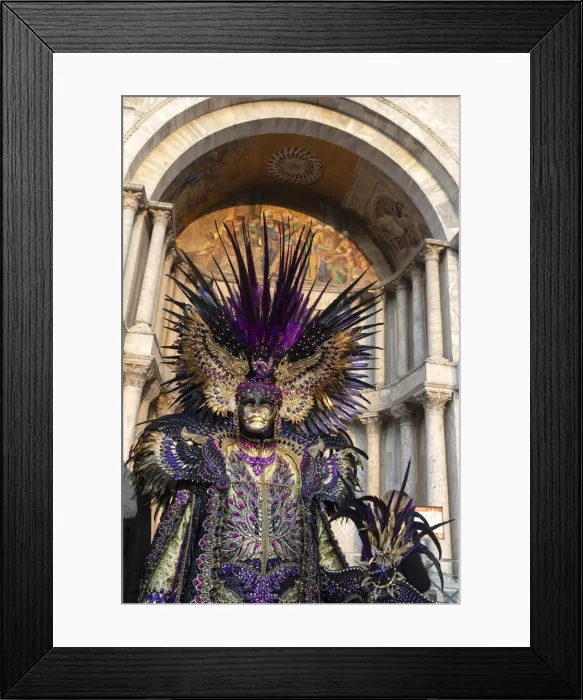 Framed Print : A man in an elaborate costume stands in front of the Basilica Saan Marco in St